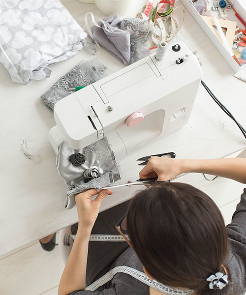 tailor-fashion-and-seamstress-concept-young-female-fashion-designer-in-her-showroom-top-view-1